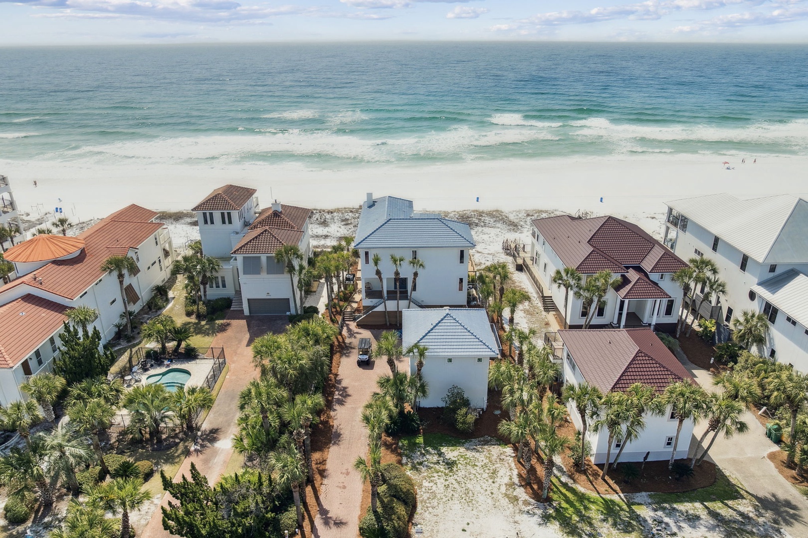 Stunning beachfront community with luxury homes just steps from pristine white sand and turquoise waters.