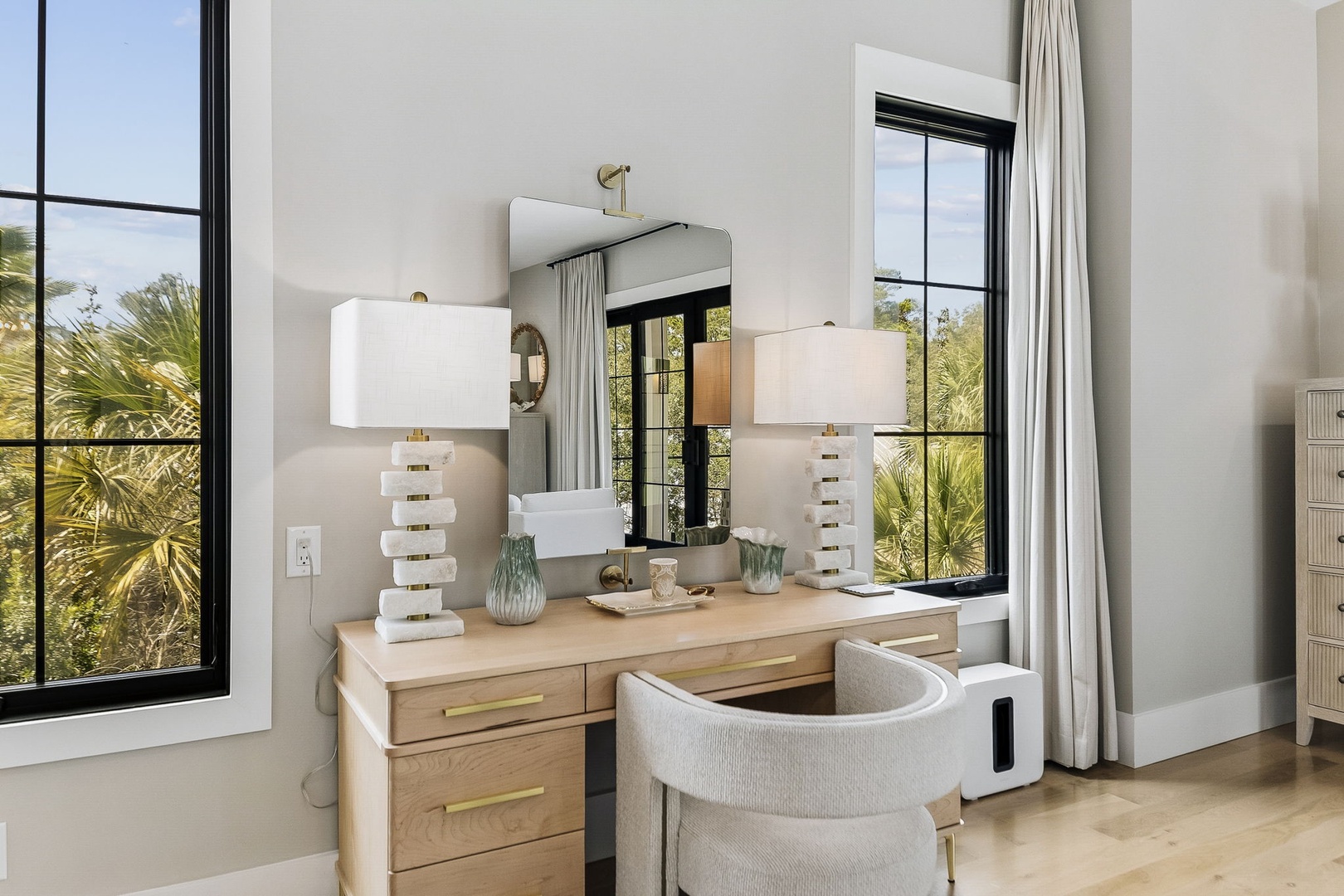 Start your day at your private vanity, where natural light pours through the windows and bright, airy tones create a calming retreat for getting ready.