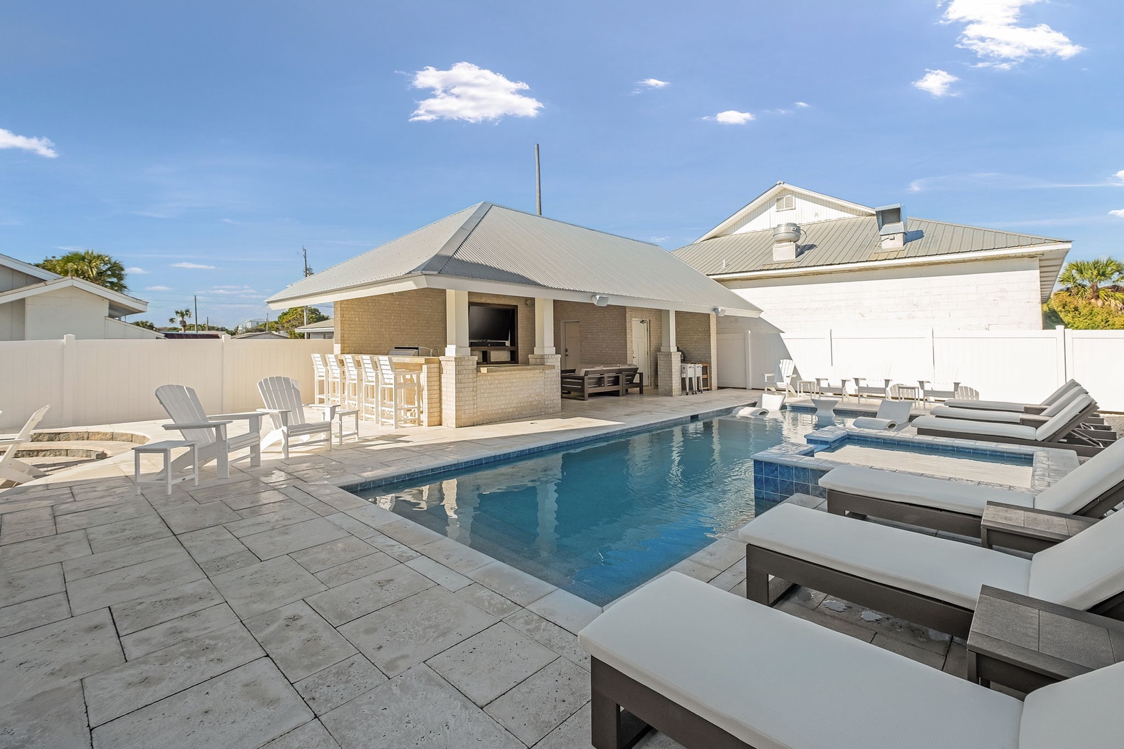 Dive into your private oasis where crystal-clear waters invite leisurely afternoons and poolside lounging creates perfect moments of relaxation.