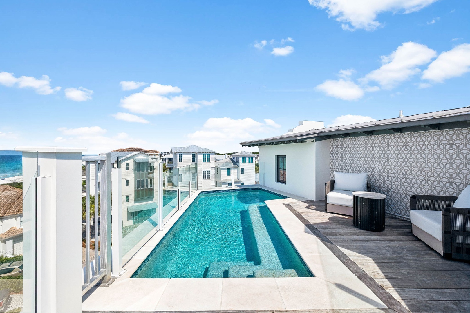 Your private rooftop oasis awaits with a sparkling pool, coastal breezes, and endless ocean views. Soak up the sun or unwind in the shade—this is vacation perfection.