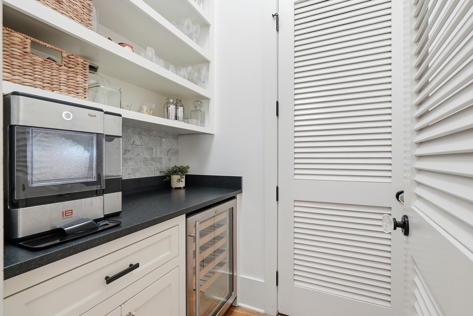 Your very own butler's pantry awaits, complete with a wine fridge and sleek countertops for effortless entertaining and meal prep.