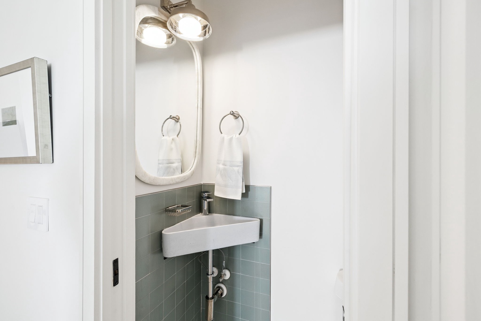 Your private corner sink features sleek modern fixtures and soft lighting, creating a serene space for your morning routine.