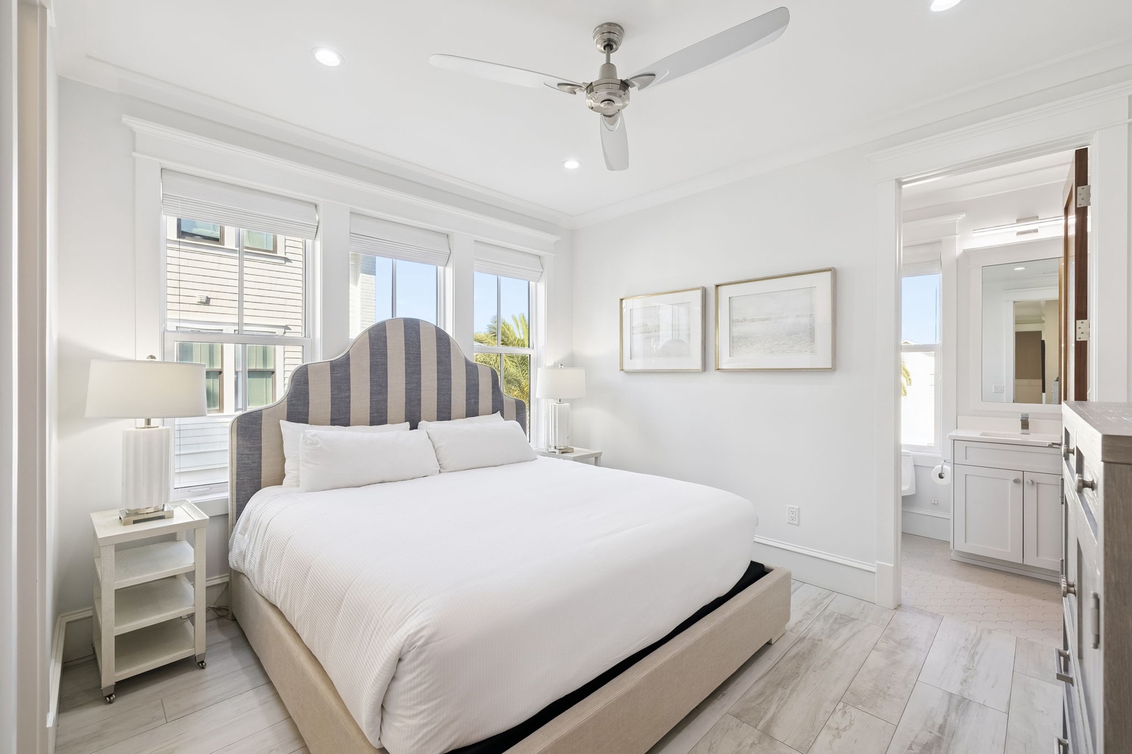 Rest peacefully in your bright, airy bedroom featuring coastal-inspired decor, crisp linens, and modern amenities for ultimate comfort.