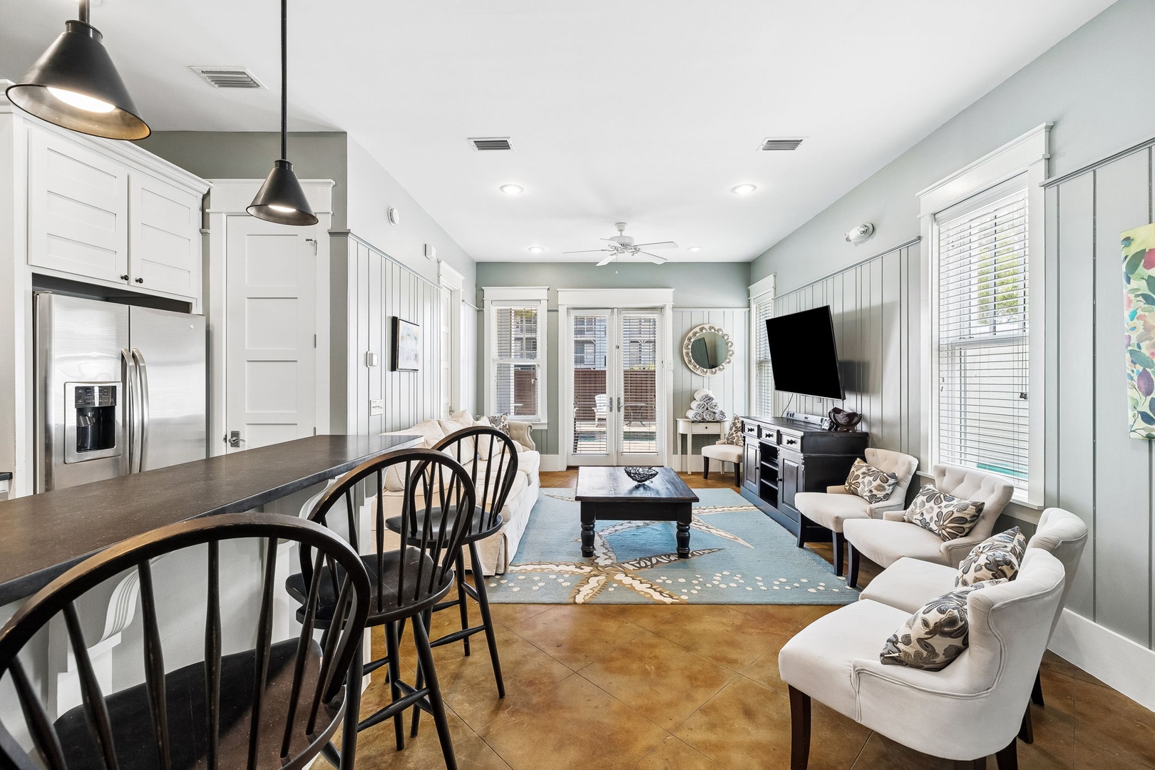 Step into this open-concept space where soft sage walls and vaulted ceilings create a bright, airy retreat perfect for unwinding after your adventures.