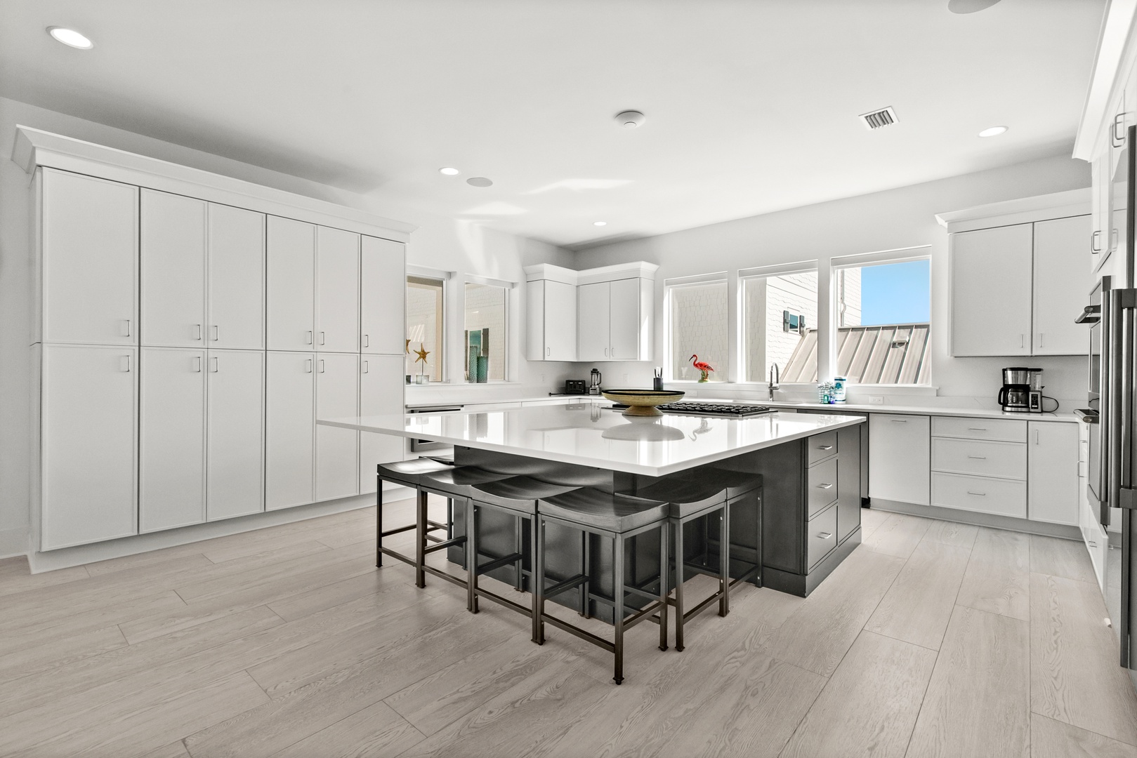 Your gourmet kitchen awaits with sleek countertops, top-tier appliances, and a spacious island perfect for cooking or gathering over morning coffee.