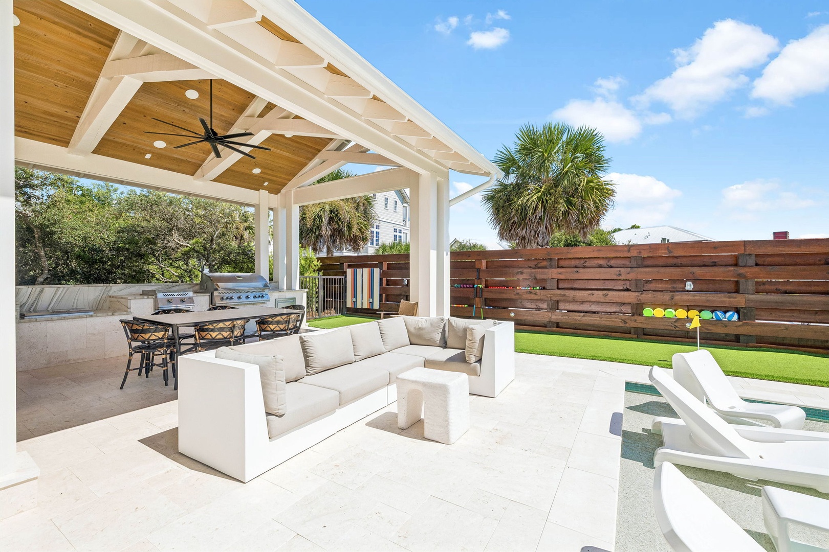 Your own resort-style retreat awaits with shaded lounging, an outdoor kitchen, and plenty of room to unwind under sunny skies.