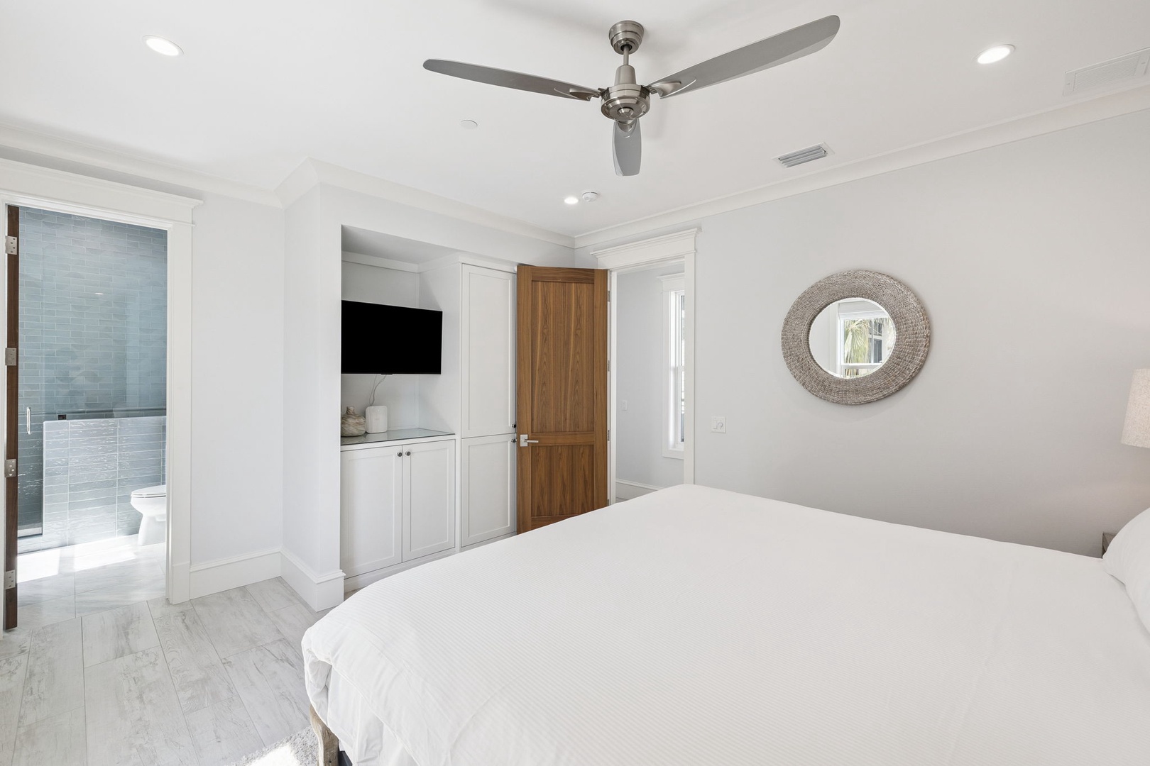 Drift into peaceful sleep in your bright, modern bedroom with crisp linens, gentle ceiling fan, and ensuite bathroom just steps away.