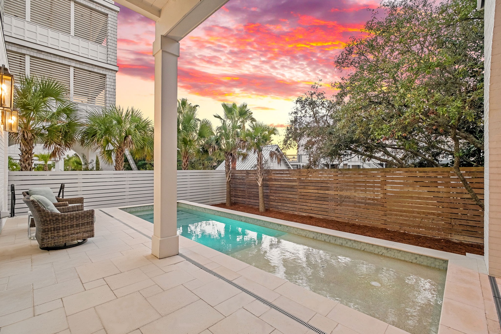 Slip into your private pool as vibrant sunset colors paint the sky, creating the perfect backdrop for evening relaxation.