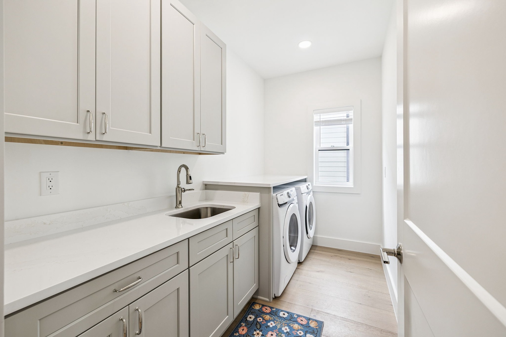 Your pristine laundry room features modern appliances and plenty of storage to keep your belongings organized during your stay.