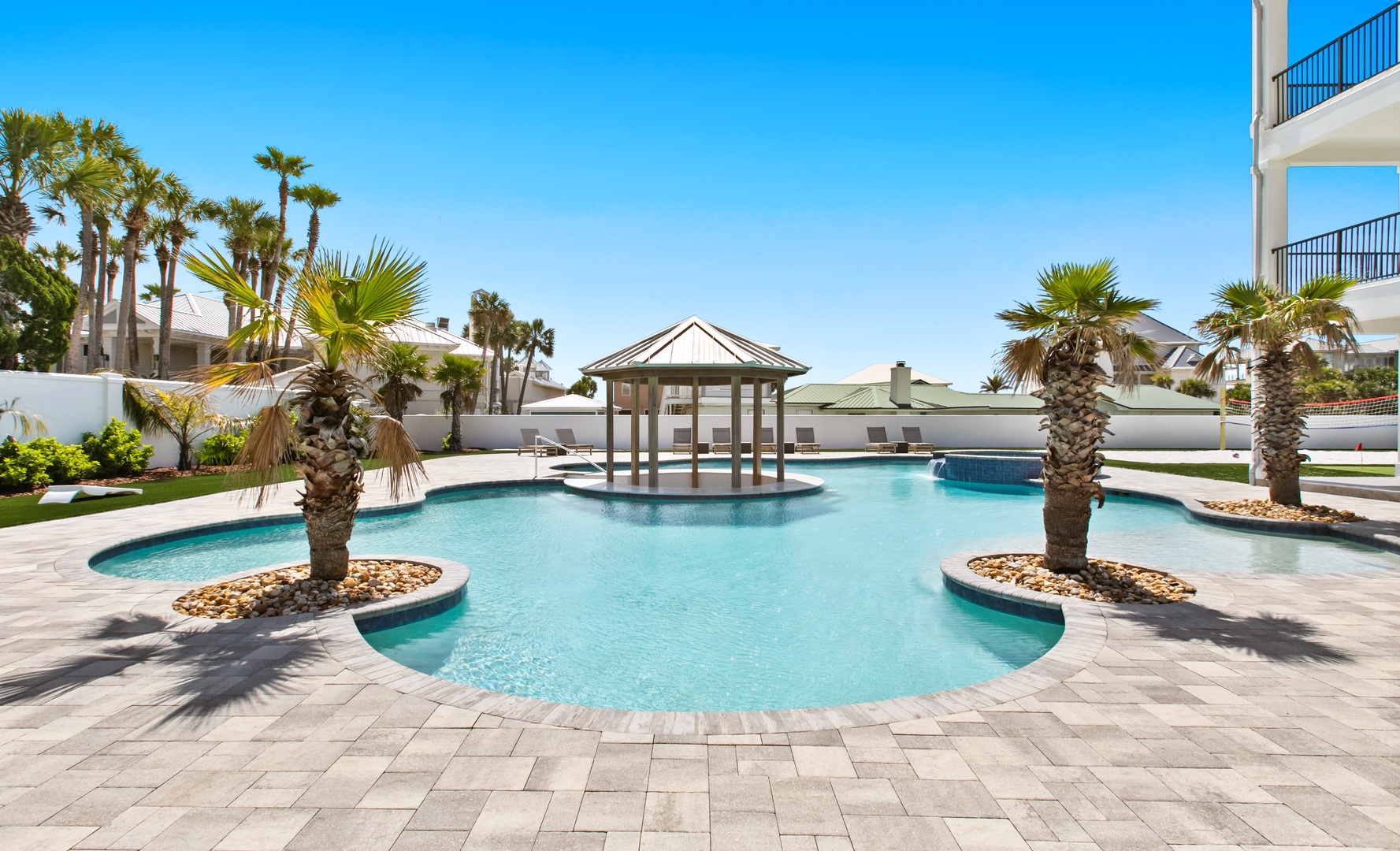 Bask in your private tropical paradise, where crystal-clear waters and swaying palms create the ultimate escape under endless blue skies.