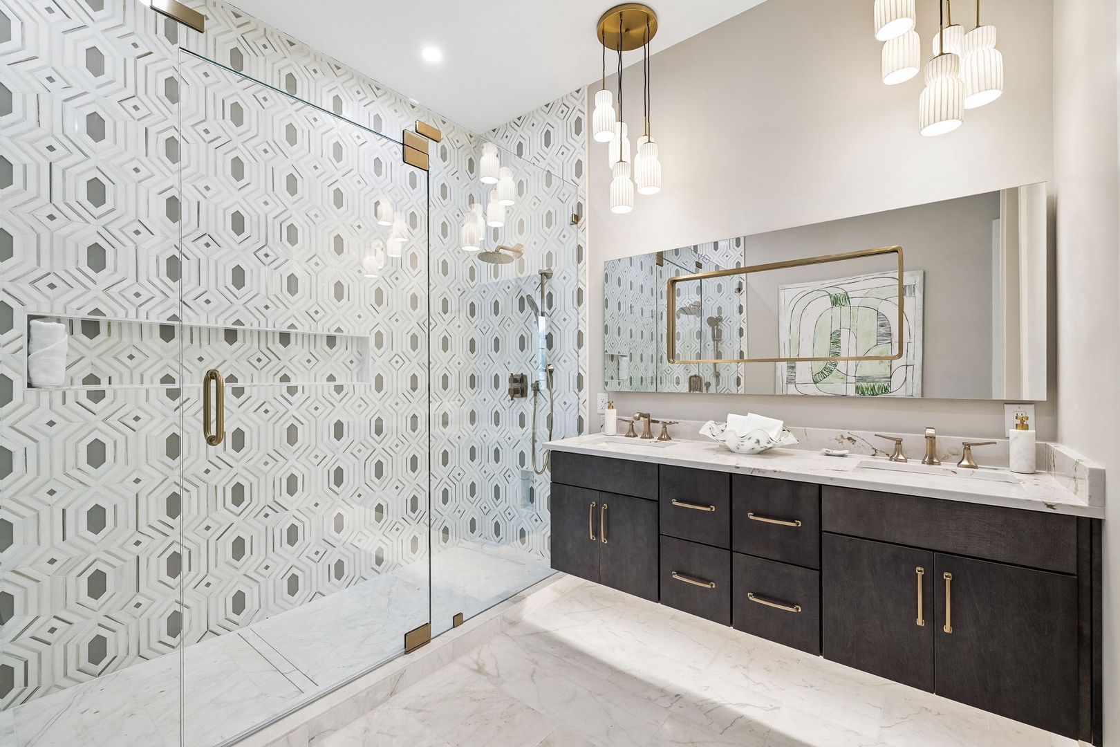 Step into your spa-like en suite, where elegant geometric tile meets modern luxury—you'll love unwinding in this designer space with dual vanities and a stunning walk-in shower.