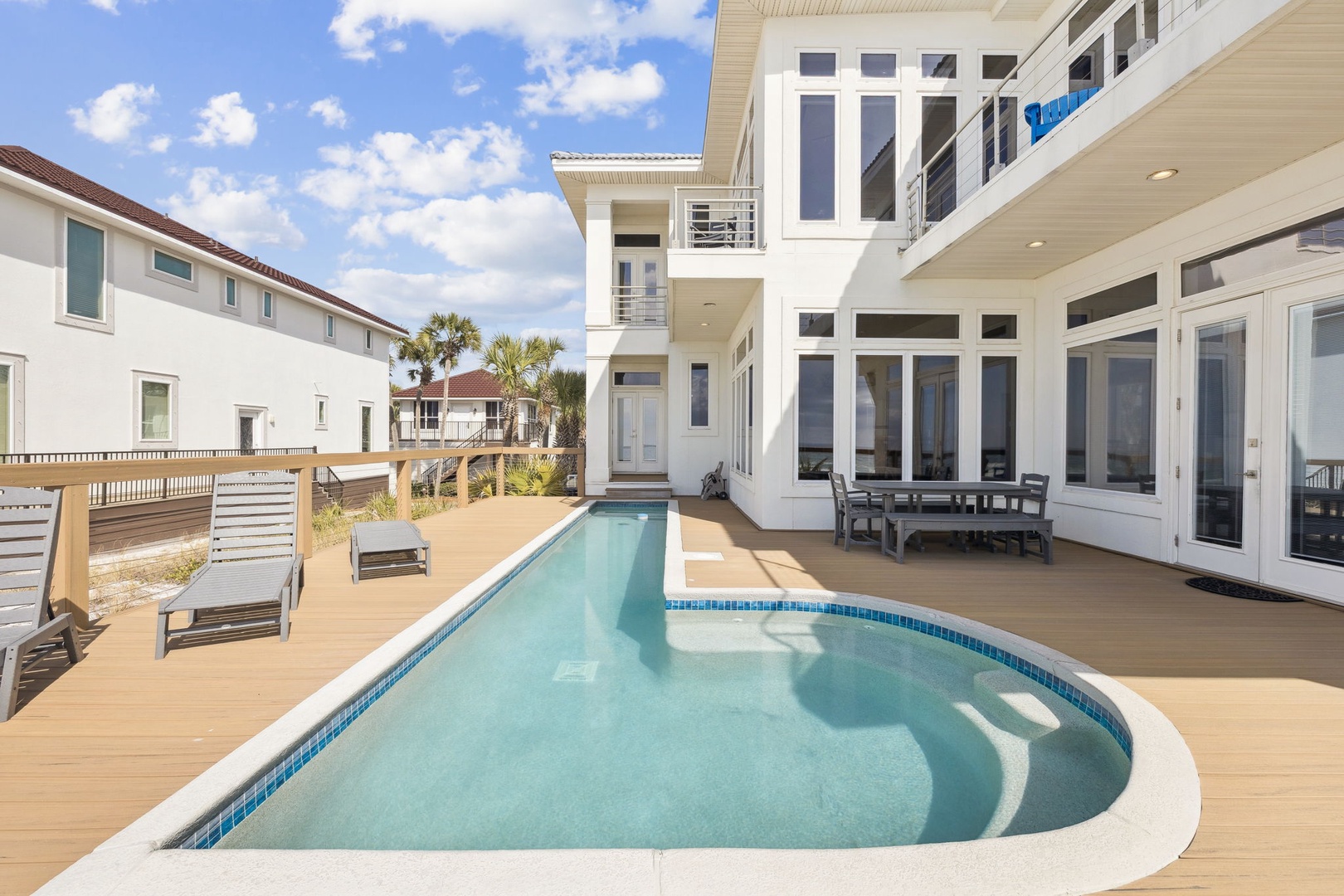 Dive into your private oasis where sparkling blue waters await beneath endless skies, while spacious decks invite you to unwind in style.