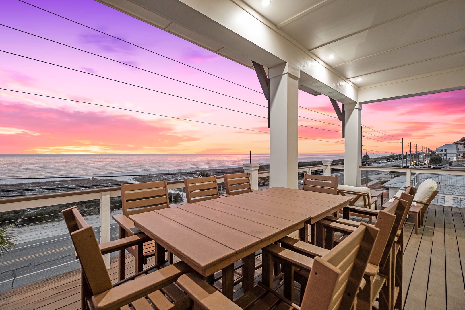 Stunning sunset views from this oceanfront deck create the perfect backdrop for memorable dinners.
