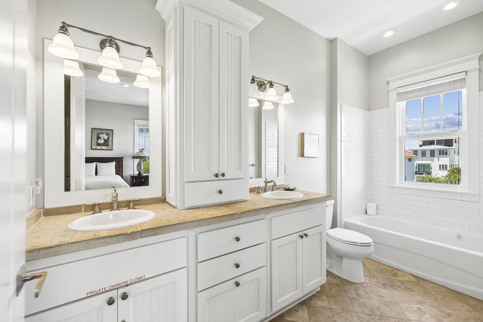 Step into your private spa-like retreat with dual vanities, a soaking tub, and bright natural light—perfect for unwinding after a day of adventure.