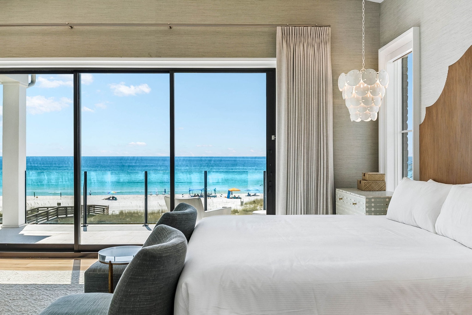 Wake up to stunning turquoise waters and sandy shores just steps from your door. Your beachfront suite offers floor-to-ceiling views, plush linens, and a private balcony where ocean breezes greet you each morning.