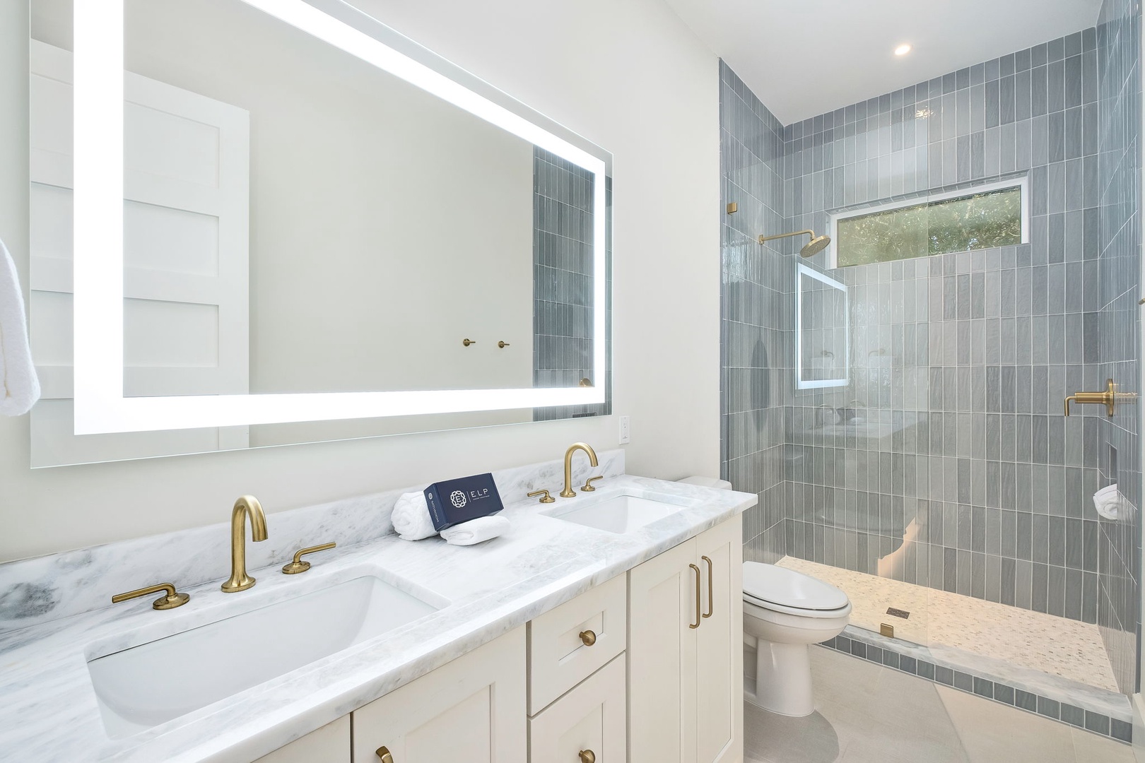 Refresh and recharge in your elegantly appointed bathroom, where marble vanities and soft lighting create a spa-like retreat. Slip into the walk-in shower beneath the rainfall showerhead and let the day's adventures wash away.