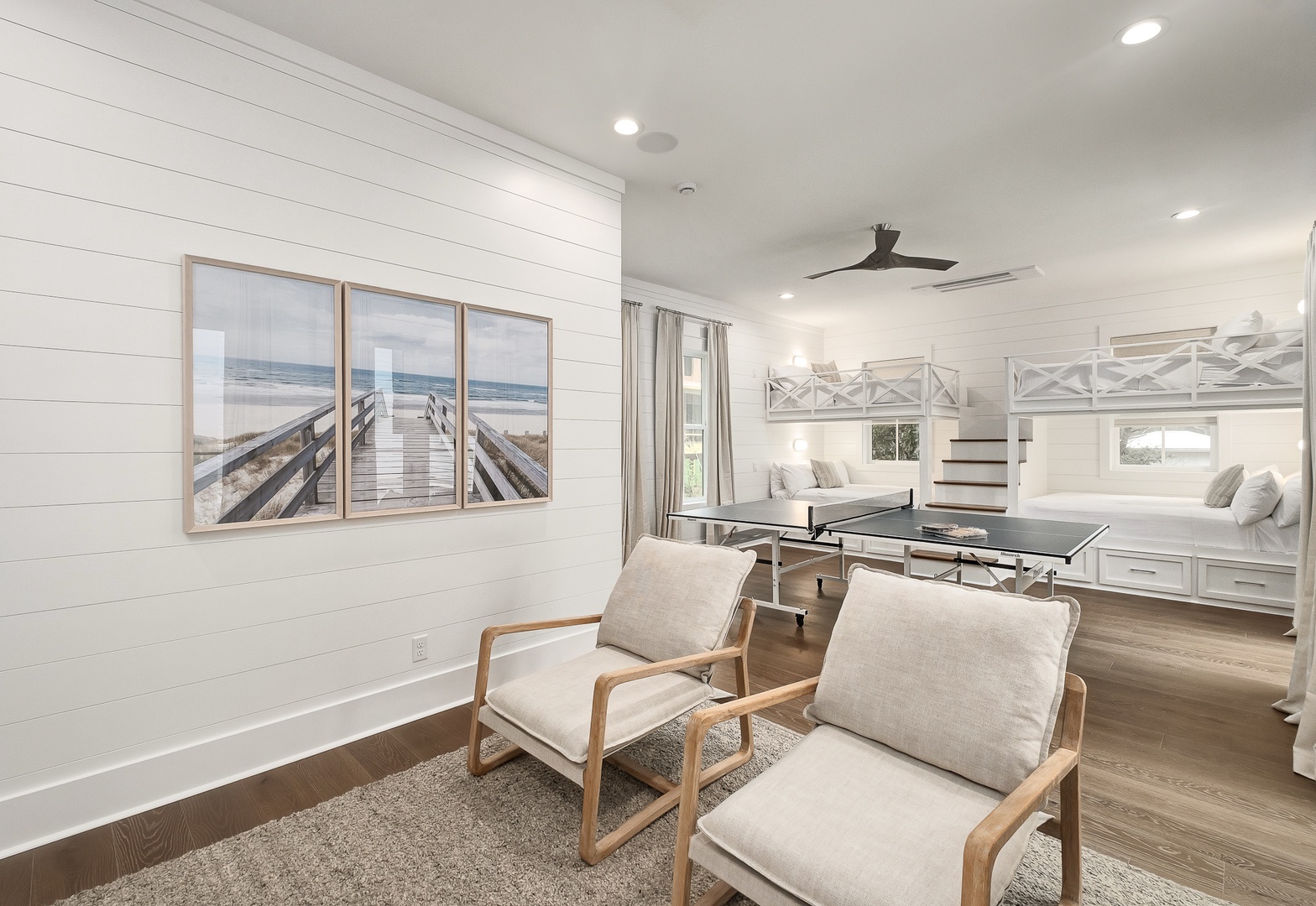 Unwind in your coastal-inspired retreat with custom bunk beds and cozy seating where beach memories are made.