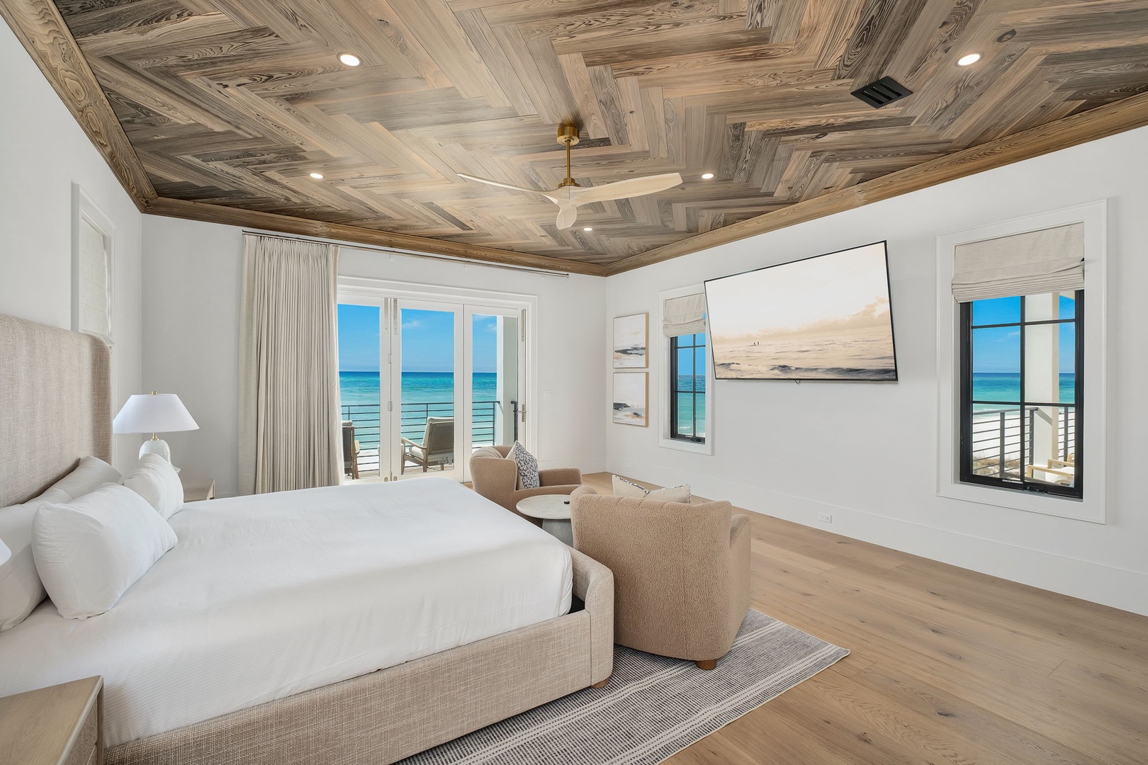 Your oceanfront bedroom offers breathtaking sea views through floor-to-ceiling windows, creating a serene coastal retreat.