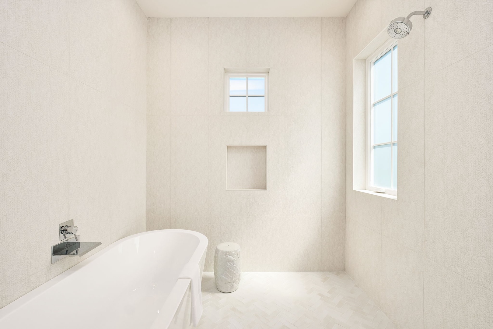 Step into your spa-like bathroom sanctuary, where warm natural light streams through windows onto pristine white surfaces.