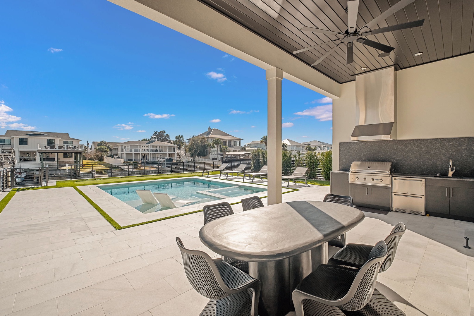 Your private poolside oasis awaits with a chef's outdoor kitchen, perfect for entertaining while you soak up Florida sunshine.