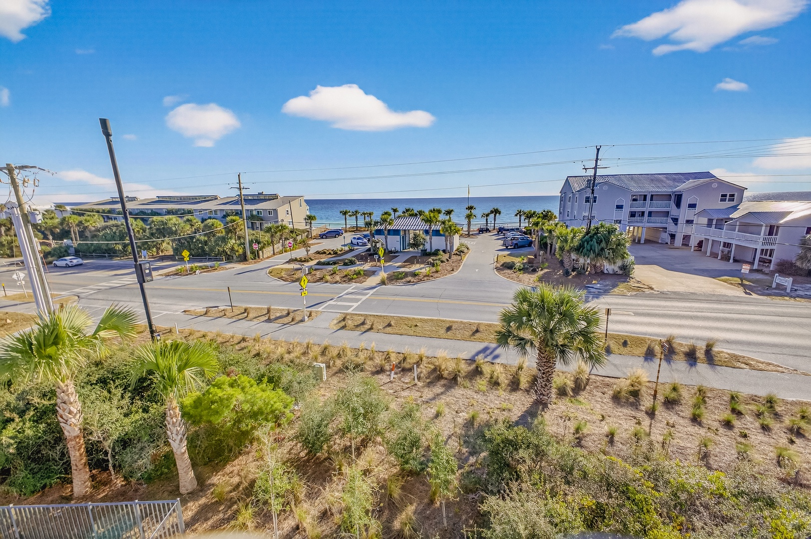 Coastal community with beach access and waterfront buildings just steps from the ocean.