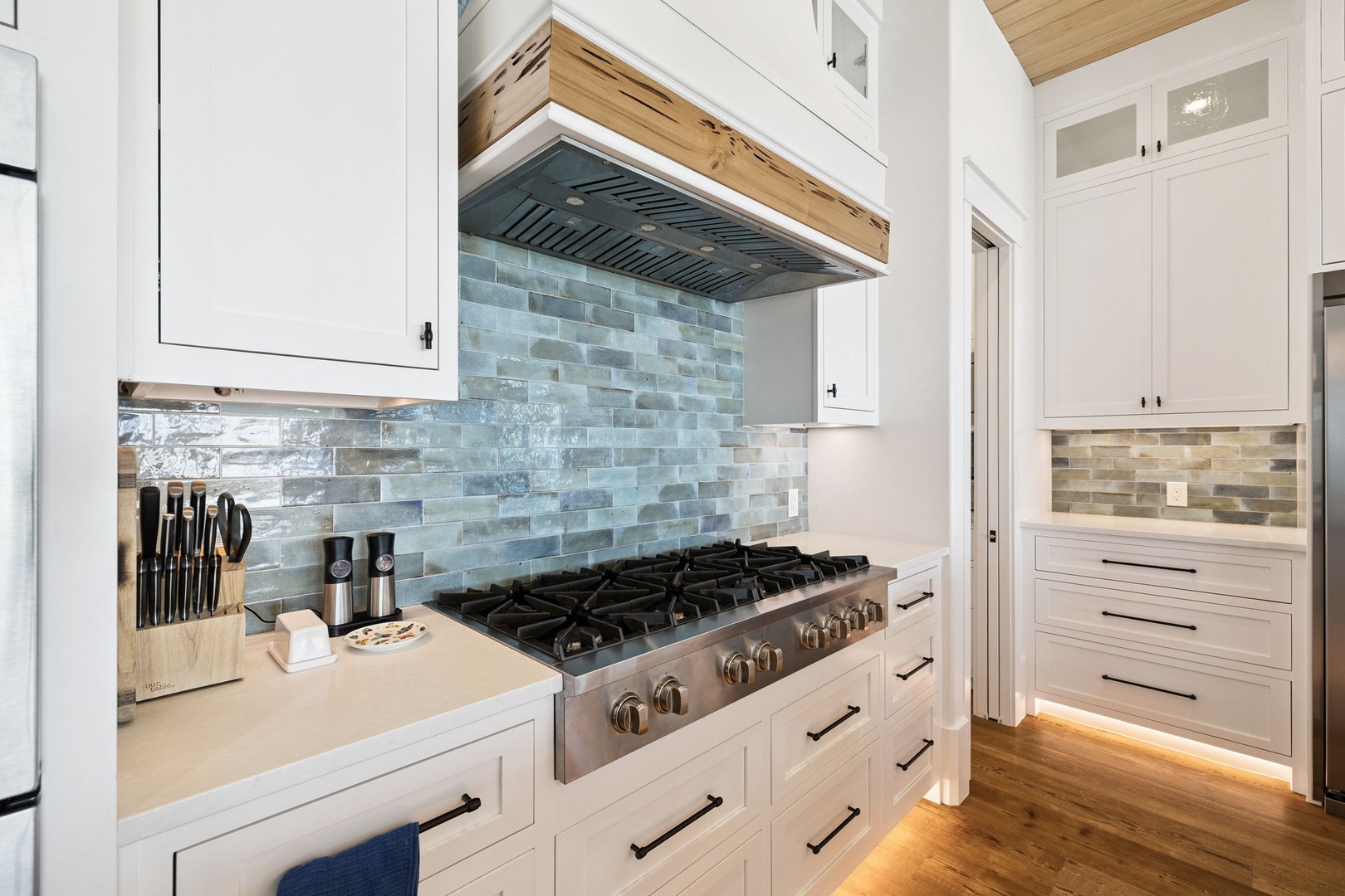 Your fully-equipped kitchen awaits with professional-grade appliances and beautiful tile backsplash for memorable cooking experiences.