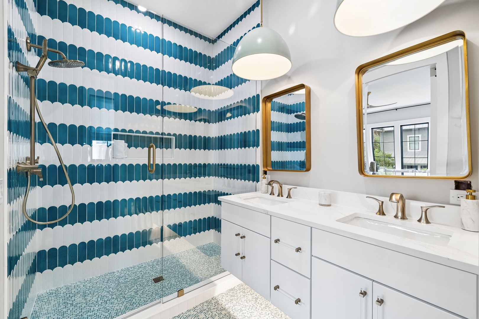 Step into a stunning bathroom where artful teal wave tiles, a spa-like walk-in shower, and gleaming fixtures create your personal oasis for refreshing mornings and relaxing evenings.