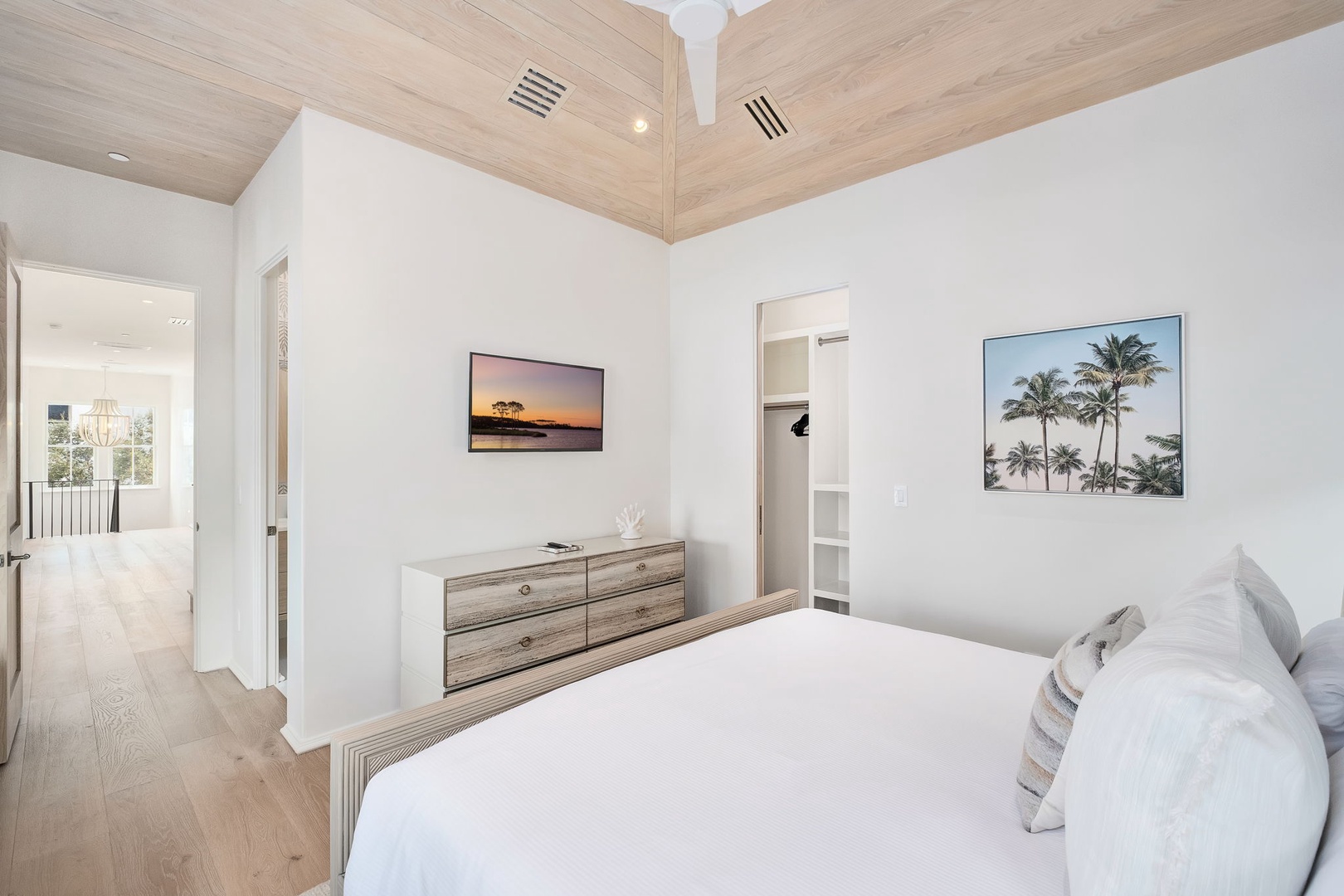 Drift into rest beneath soaring wood-beam ceilings and crisp white linens that invite you to unwind. The coastal-inspired touches and soothing tones create a tranquil retreat after your day exploring.