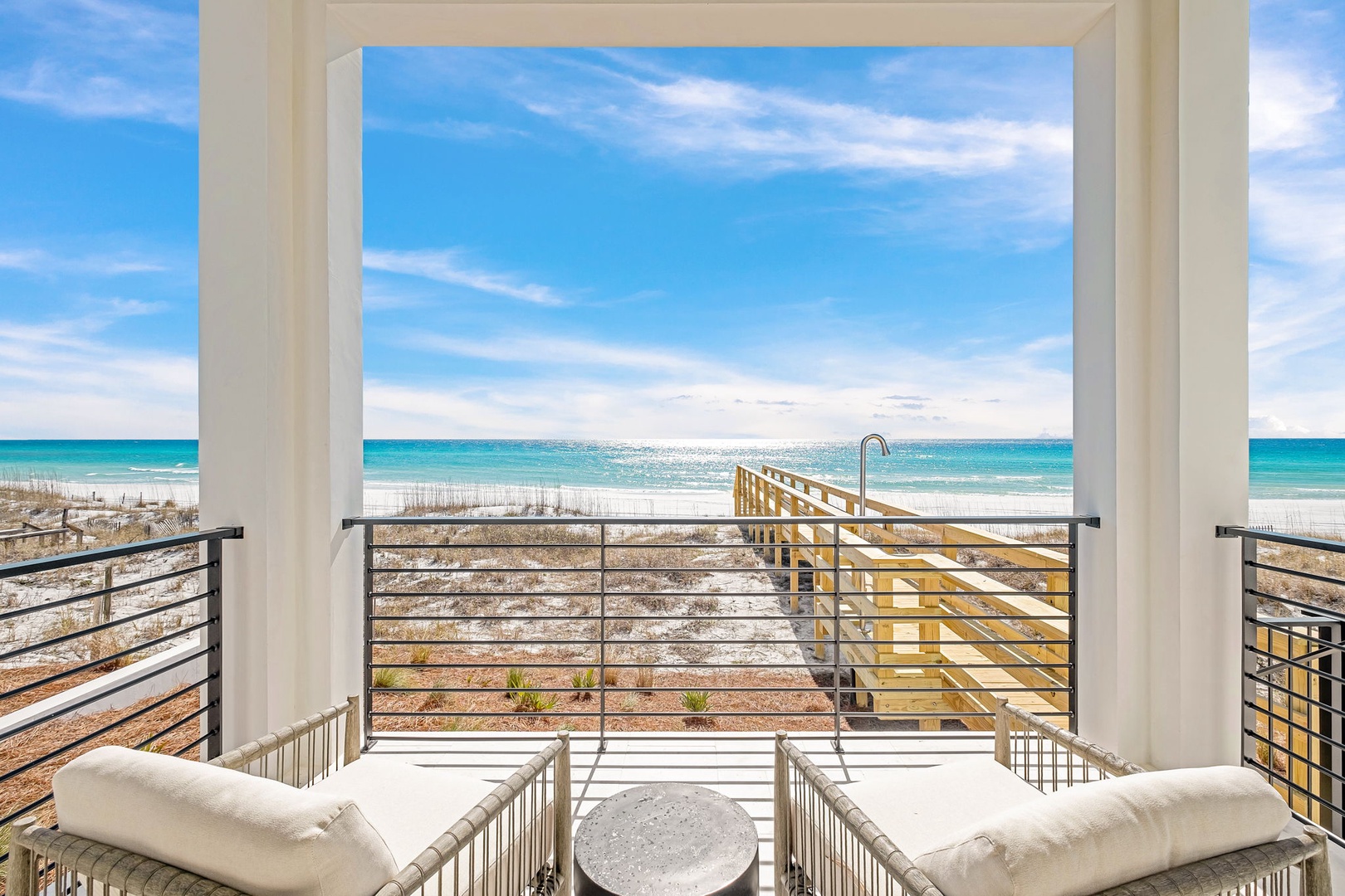 Unwind in comfort as turquoise waters and pristine white sand stretch endlessly before your private balcony retreat.