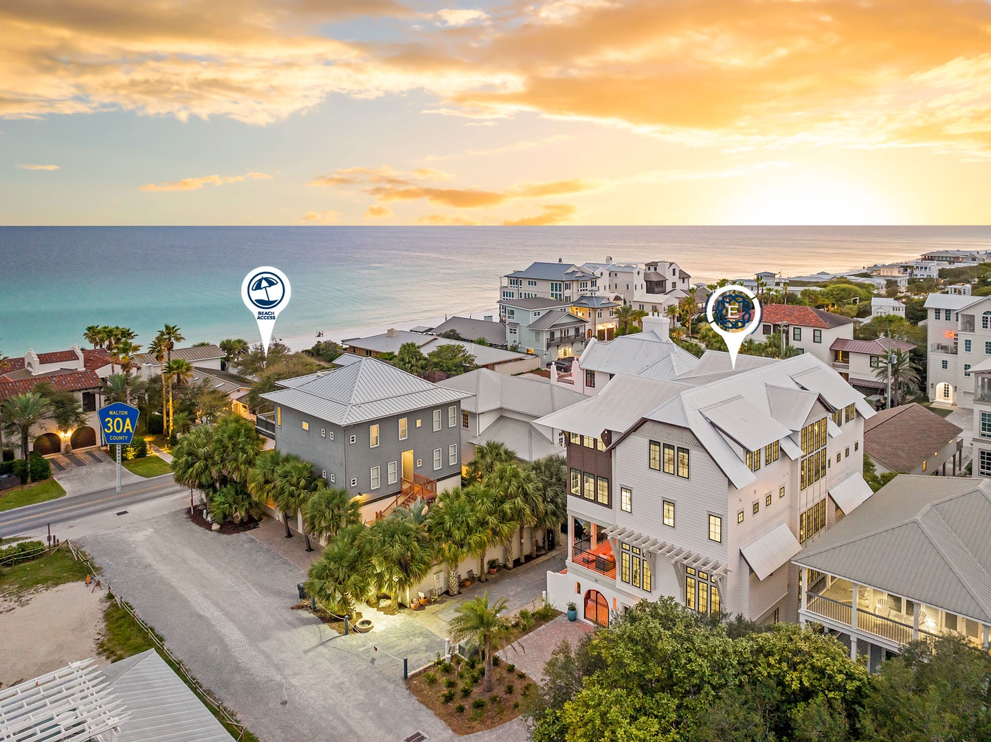 Stunning beachfront neighborhood with modern coastal architecture and pristine turquoise waters stretching to the horizon.