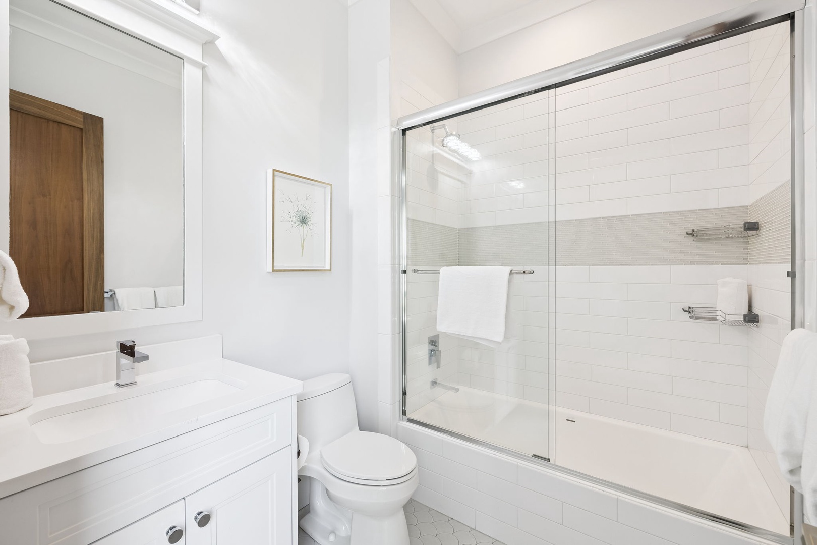 Step into your pristine bathroom featuring a spacious glass shower, modern vanity, and bright clean finishes for a refreshing morning routine.