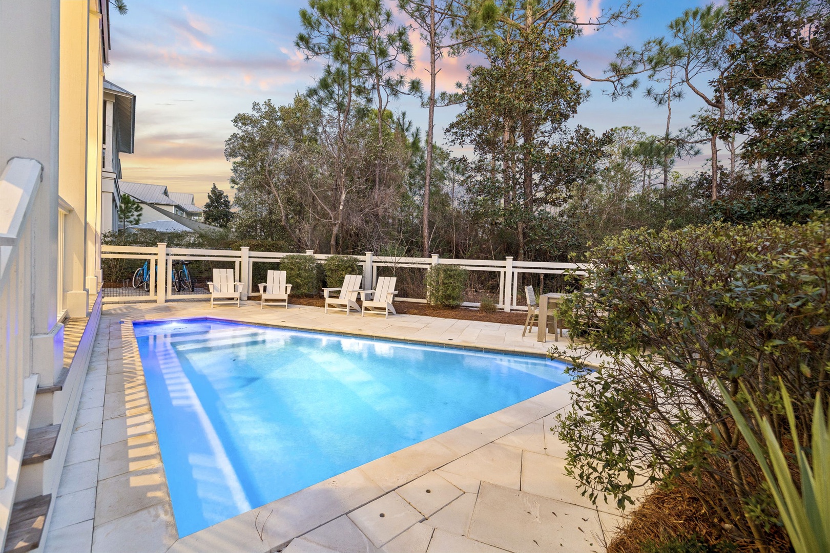 Dive into your private pool as the sky paints itself in soft pastels, surrounded by lush native gardens.