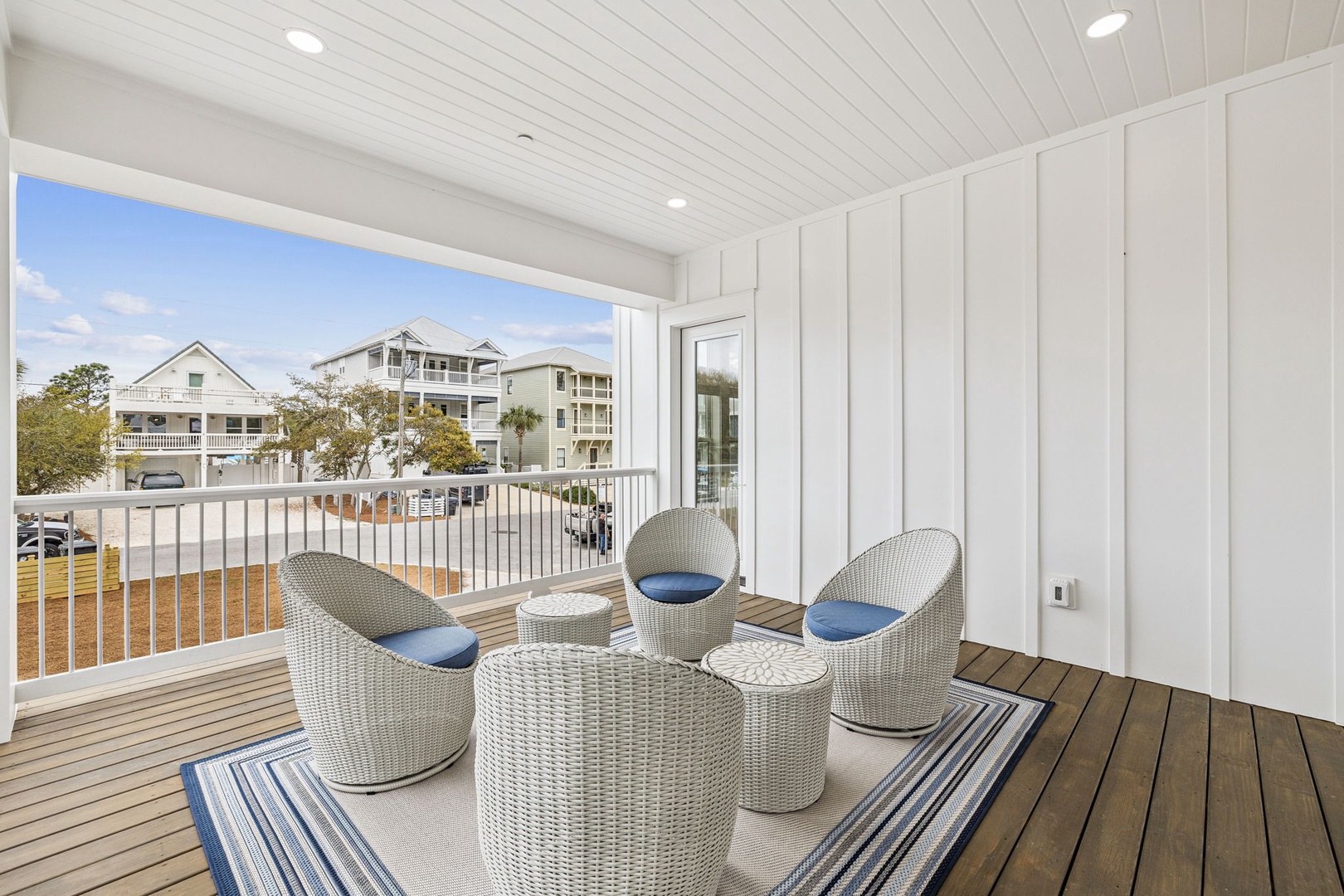 Unwind on your private balcony with cozy wicker seating and refreshing coastal breezes.