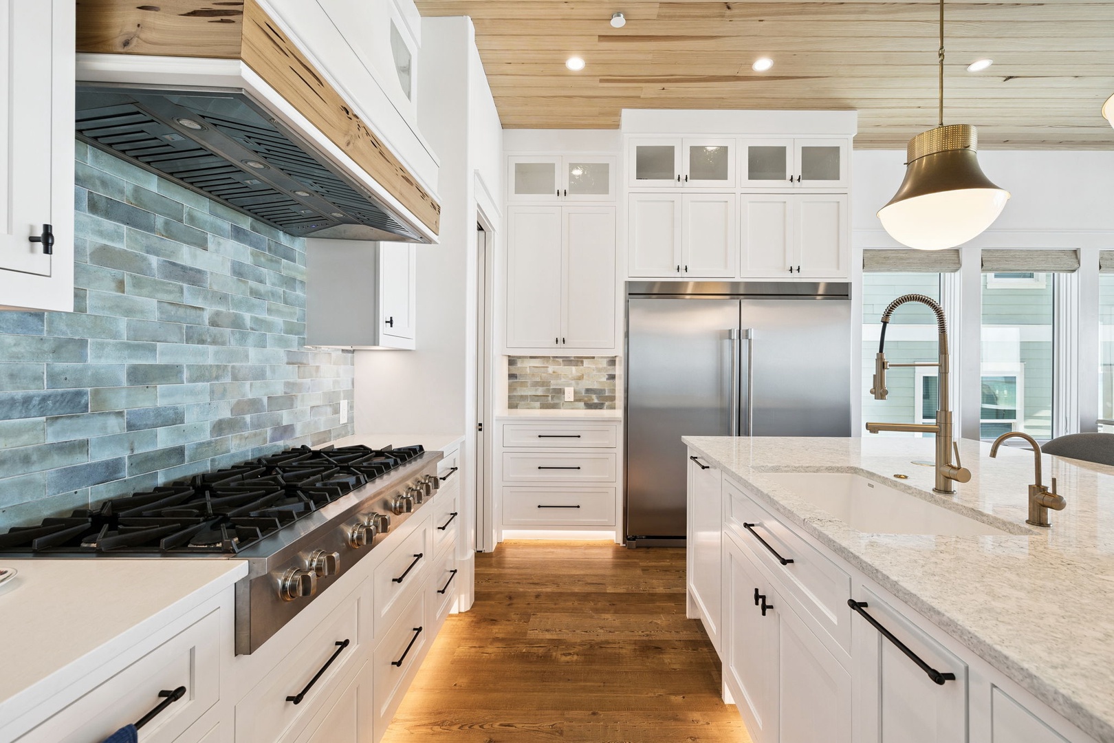 Cook memorable meals in this stunning kitchen featuring marble countertops, custom cabinetry, and professional-grade appliances.