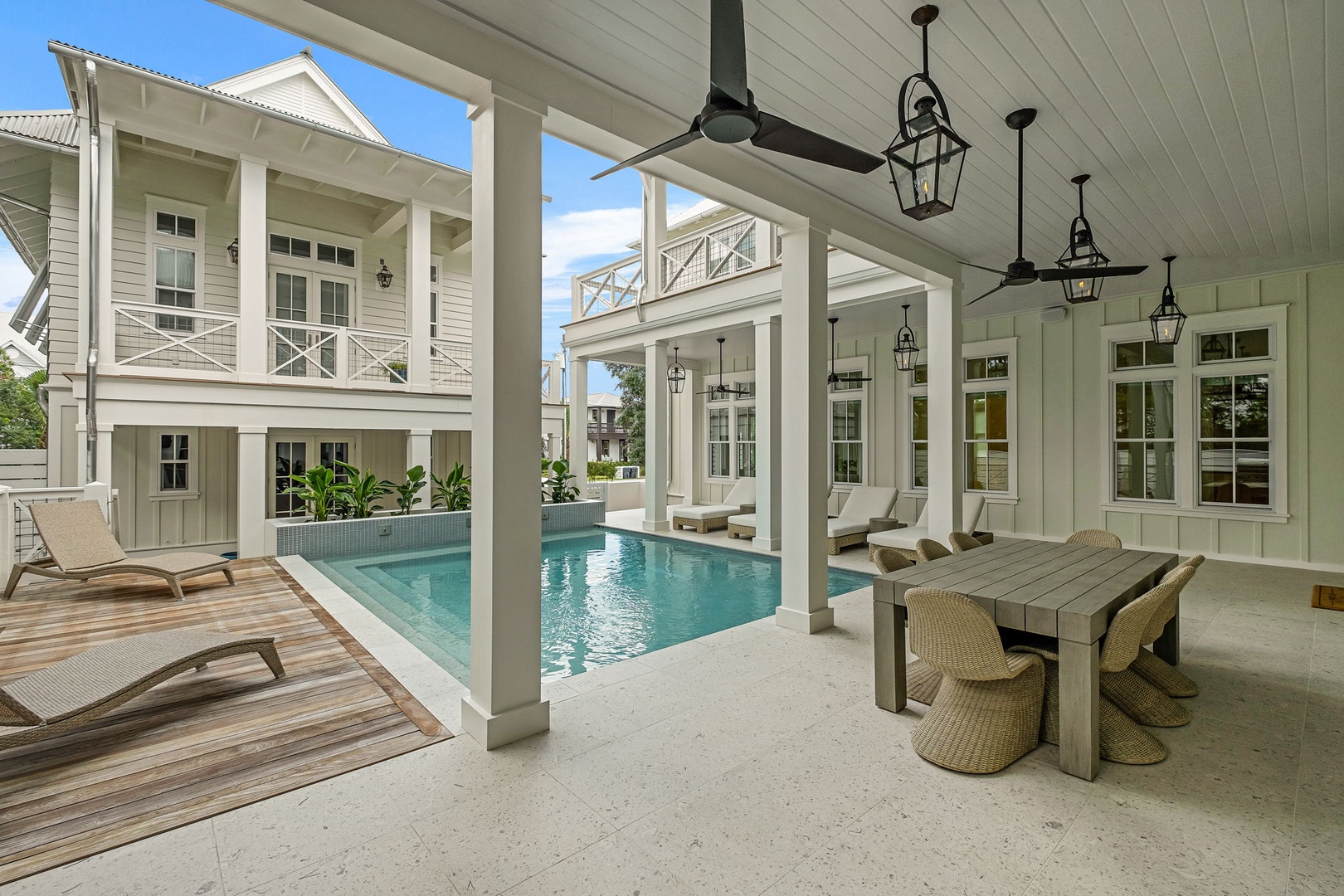 Step into your private courtyard retreat, where a sparkling pool awaits beneath graceful columns and lantern lighting. Lounge by the water or dine alfresco—your sanctuary for sun-soaked days and balmy Southern evenings.