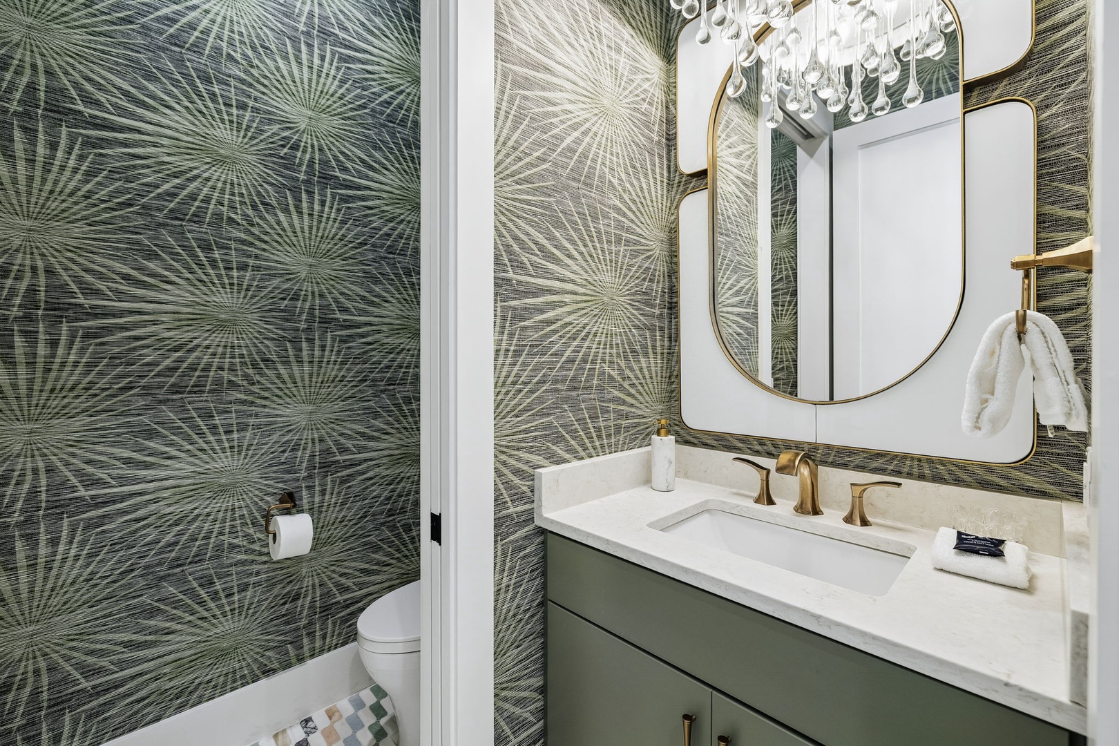 Step into your private sanctuary, where tropical elegance meets modern comfort. Bold botanical wallpaper and gleaming brass fixtures transform your daily routine into a spa-like escape.