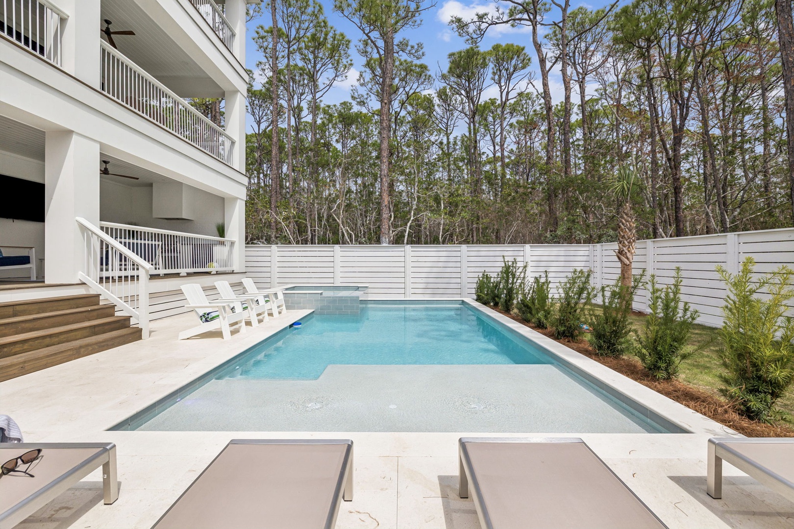 Take a refreshing dip in your private swimming pool, surrounded by lush trees and modern comfort.