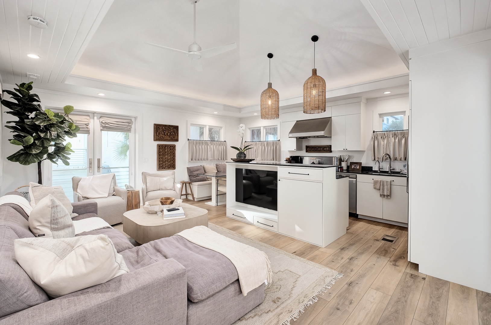 Relax in your bright, modern living space where natural light streams through oversized windows into the open-concept design.