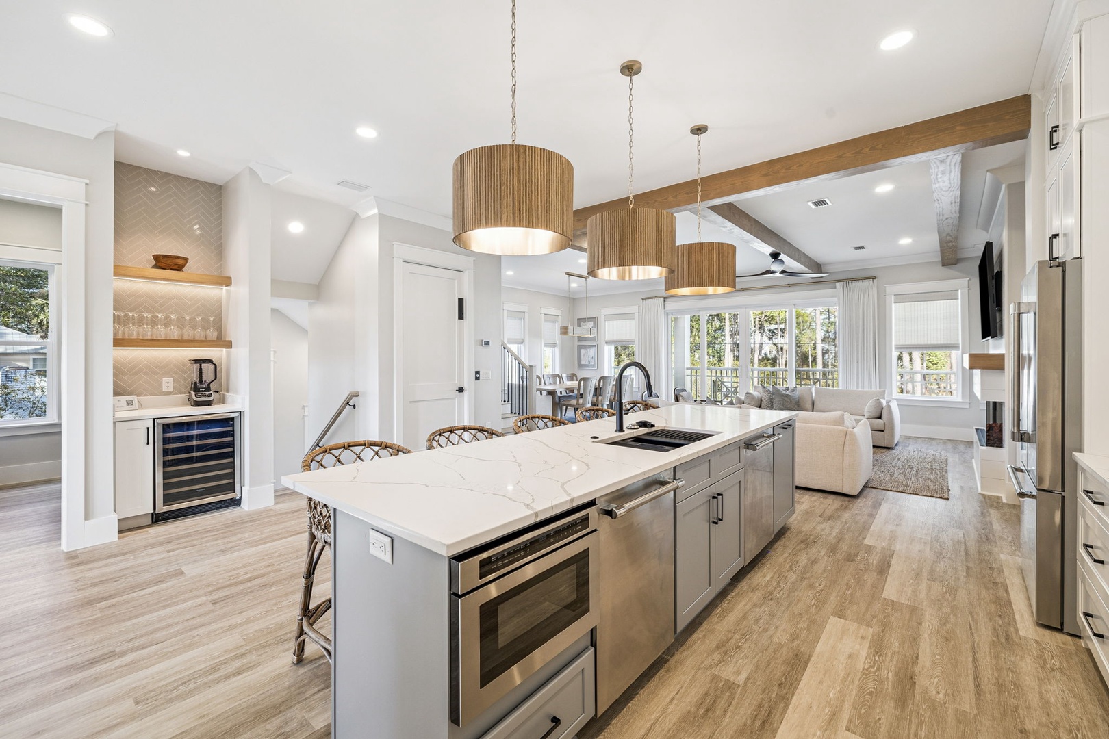 Your gourmet kitchen flows seamlessly into the living space, featuring a marble island perfect for morning coffee and evening cocktails.