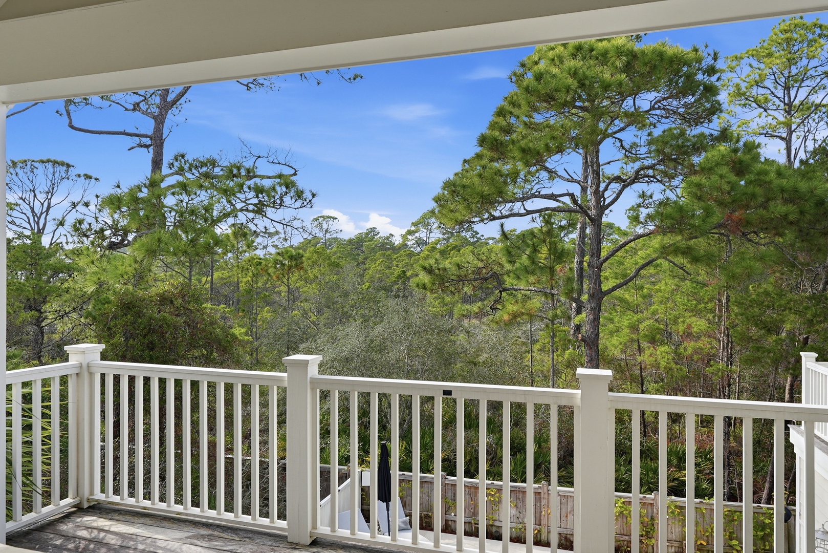Relax on your private balcony and take in serene treetop views over the lush natural surroundings—a peaceful retreat after a day of exploring the area.