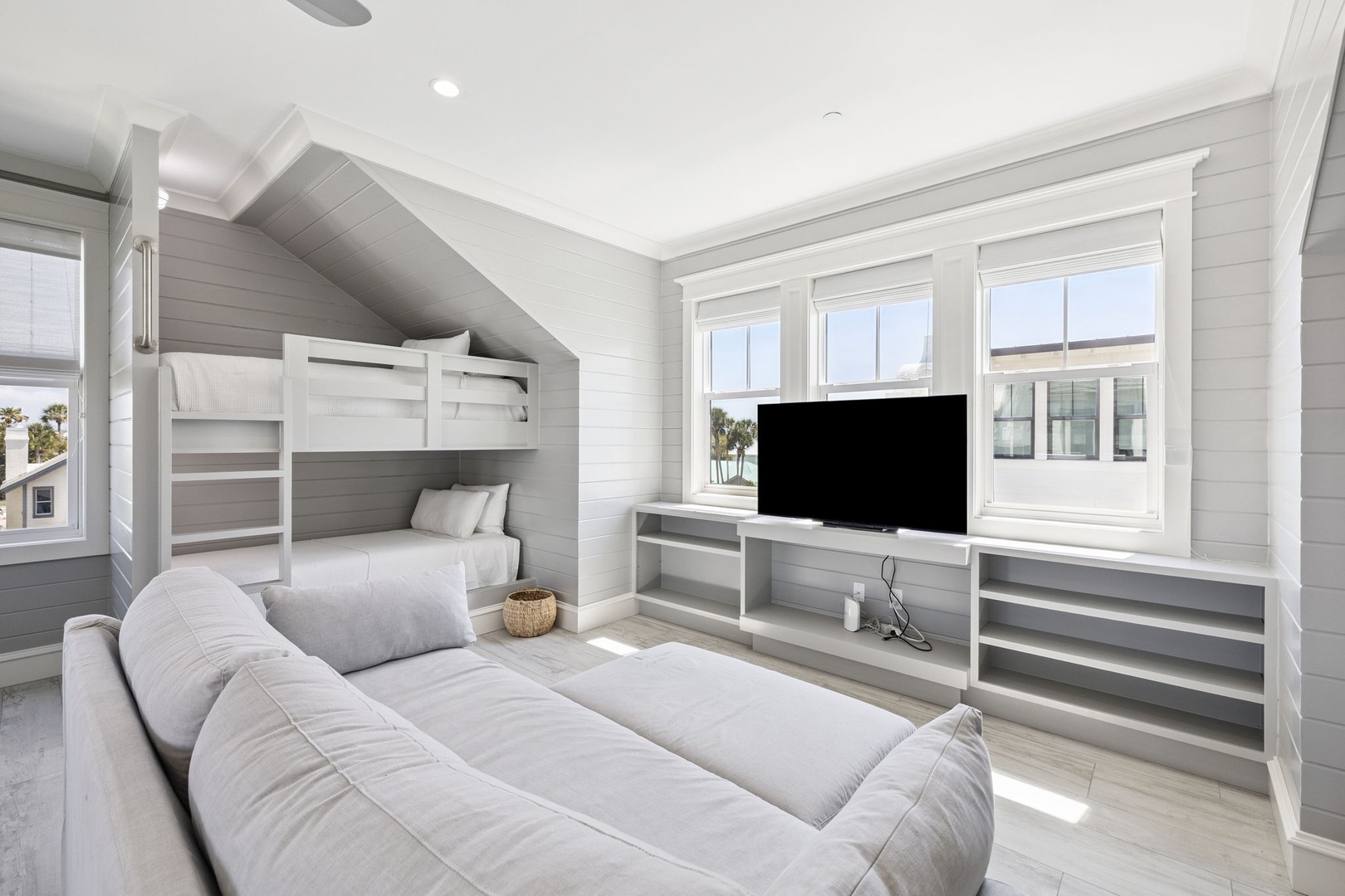 You'll love this bright, family-friendly space with built-in bunk beds and cozy seating for movie nights or relaxing together.