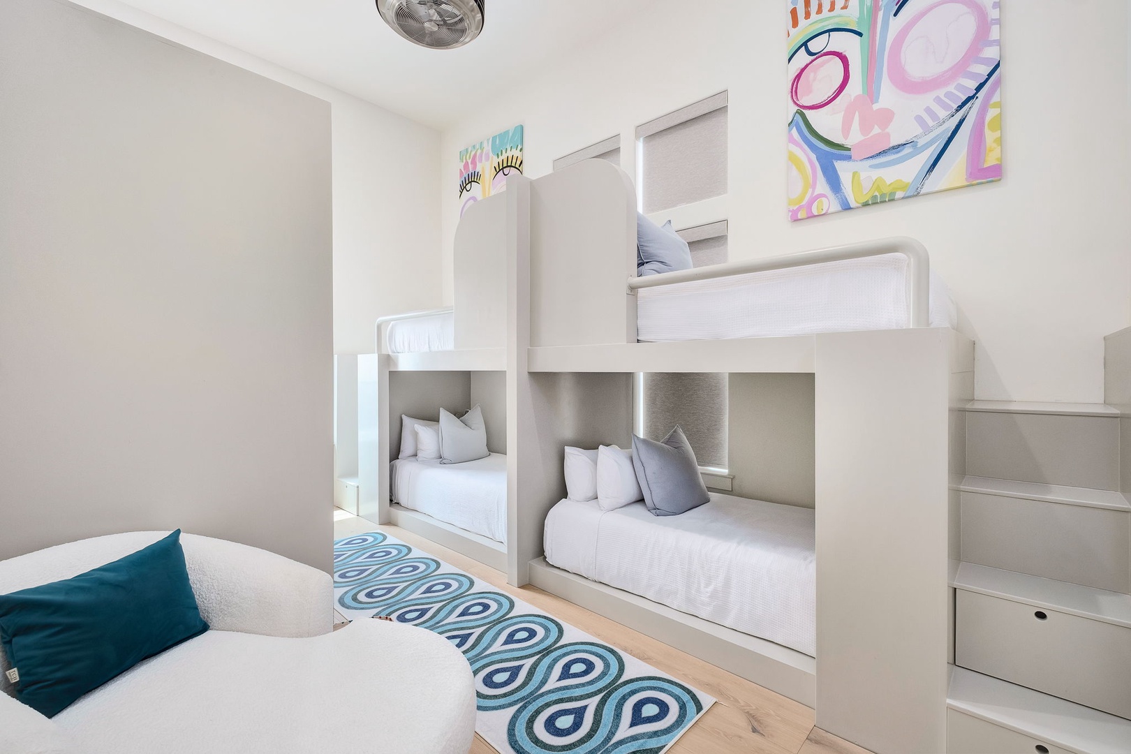 Your kids will love this bright, cheerful bunk room with built-in beds and playful accents—perfect for rest and giggles after a busy day exploring.