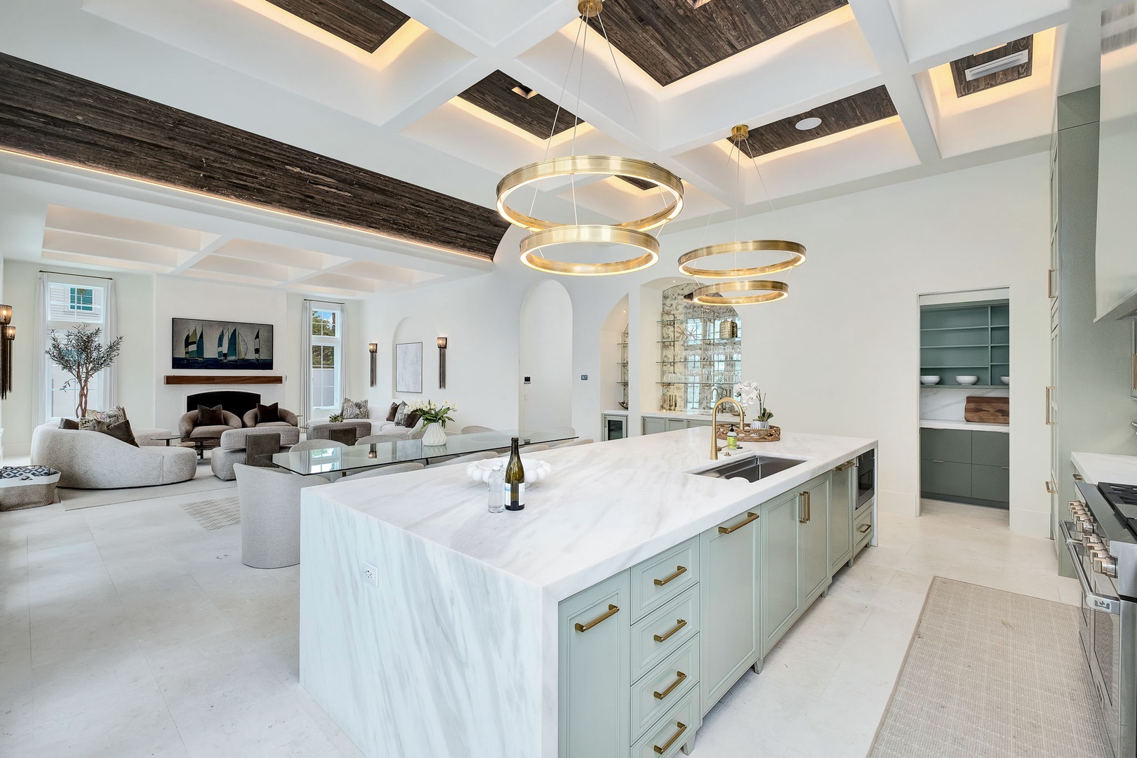 Your dream kitchen awaits with gorgeous marble countertops, designer lighting, and an open flow into a sophisticated living area—perfect for both cooking and entertaining in style.