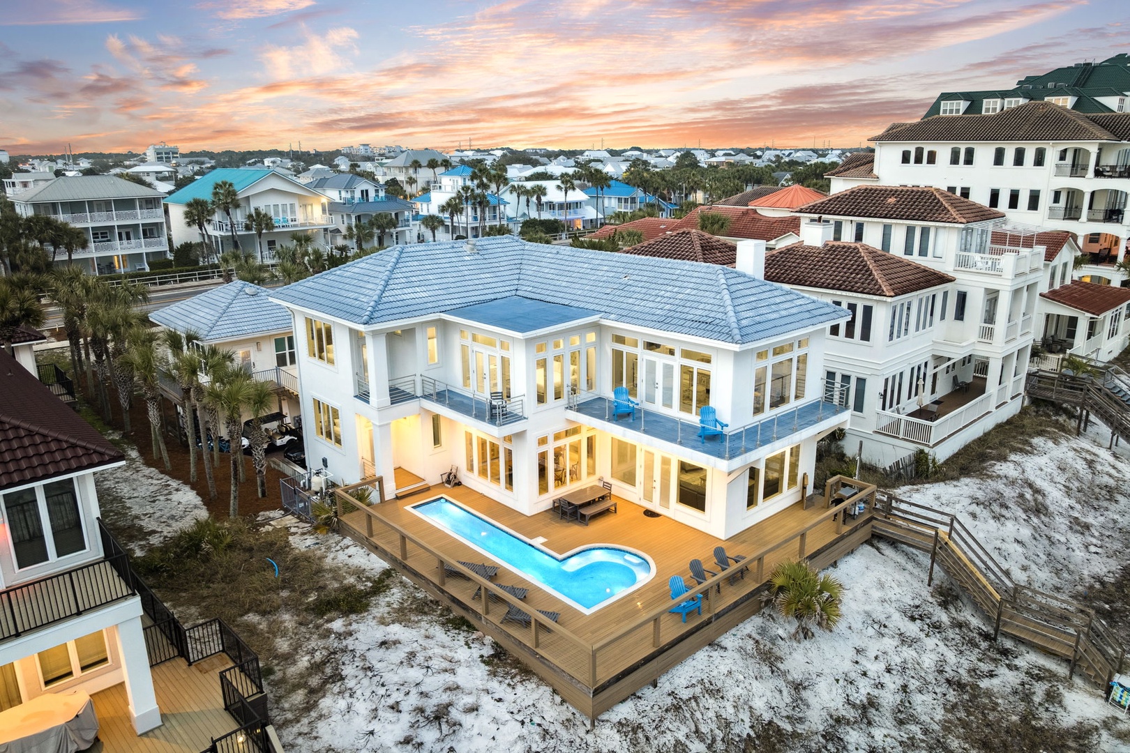 Stunning beachside estate with private pool showcases coastal luxury in this vibrant neighborhood setting.