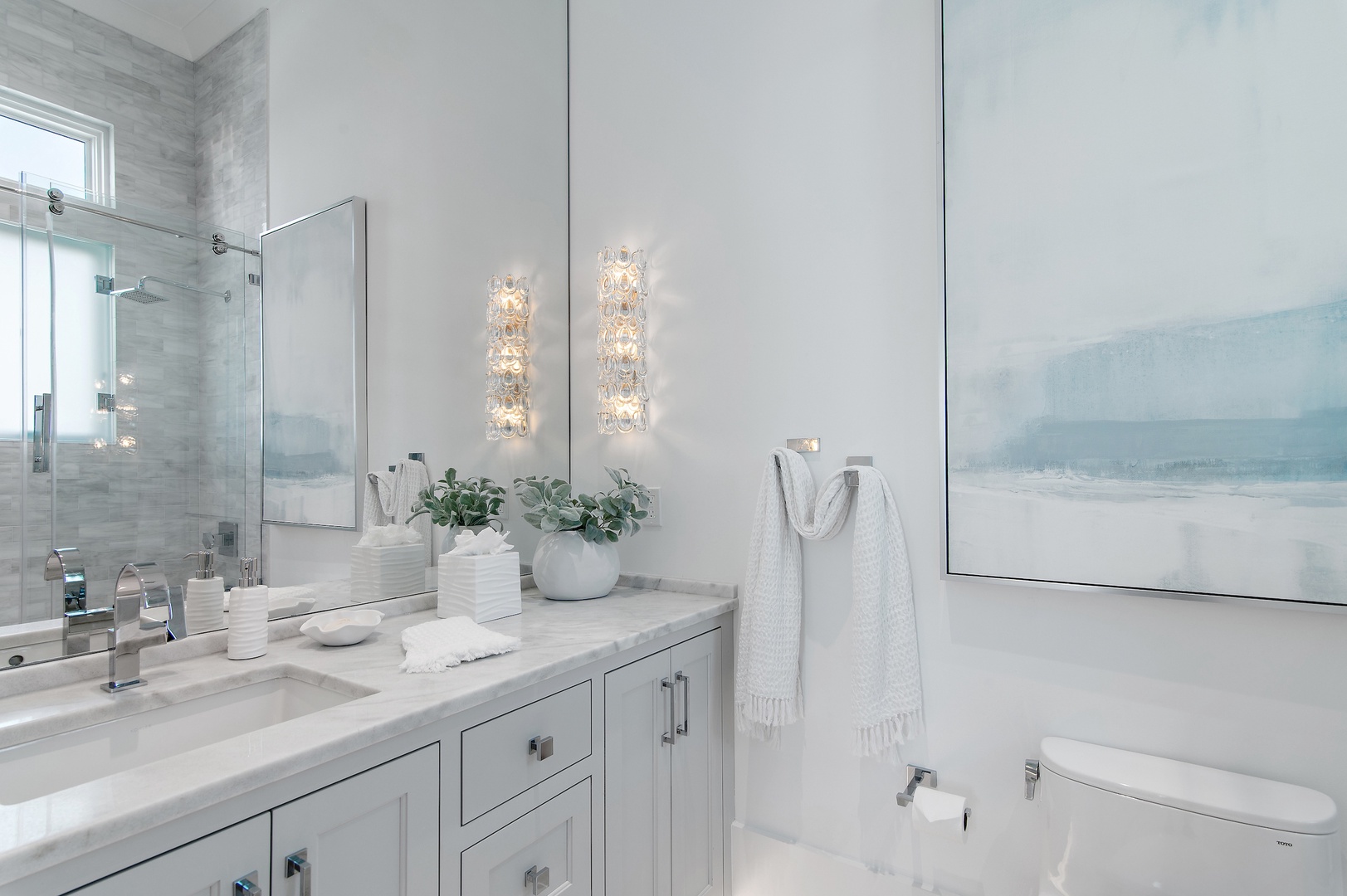 Slip into serenity in your private spa-like bathroom. Elegant marble surfaces, sophisticated lighting, and plush towels await you after a refreshing shower.