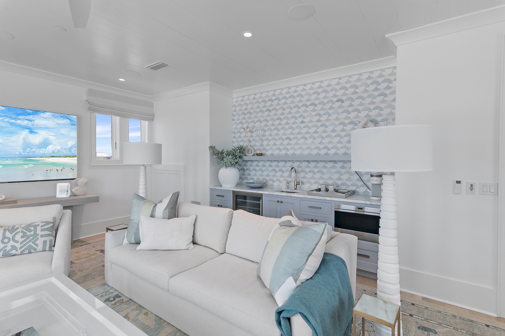 Relax in your bright, airy living space featuring ocean views, a well-appointed kitchen with modern appliances, and coastal-chic decor that invites you to unwind in seaside comfort.