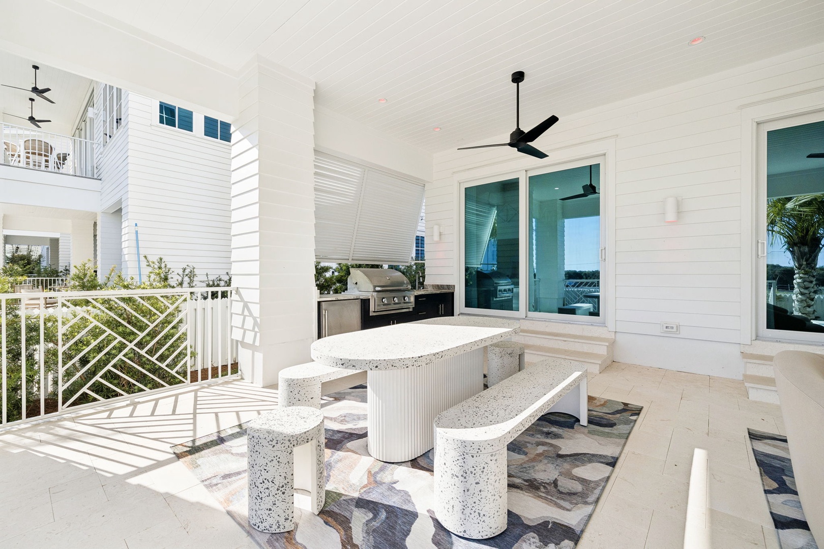 Your private balcony features a stylish concrete dining set where you can enjoy meals with refreshing breezes and peaceful surroundings.