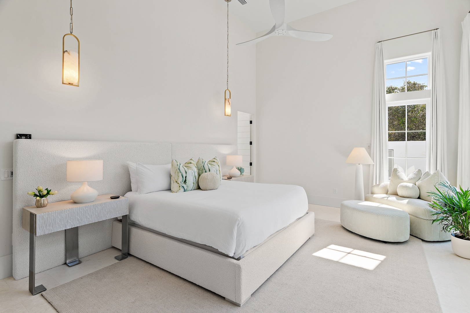 You'll drift off in this serene bedroom, where soft natural light, plush bedding, and elegant coastal touches create your perfect retreat.