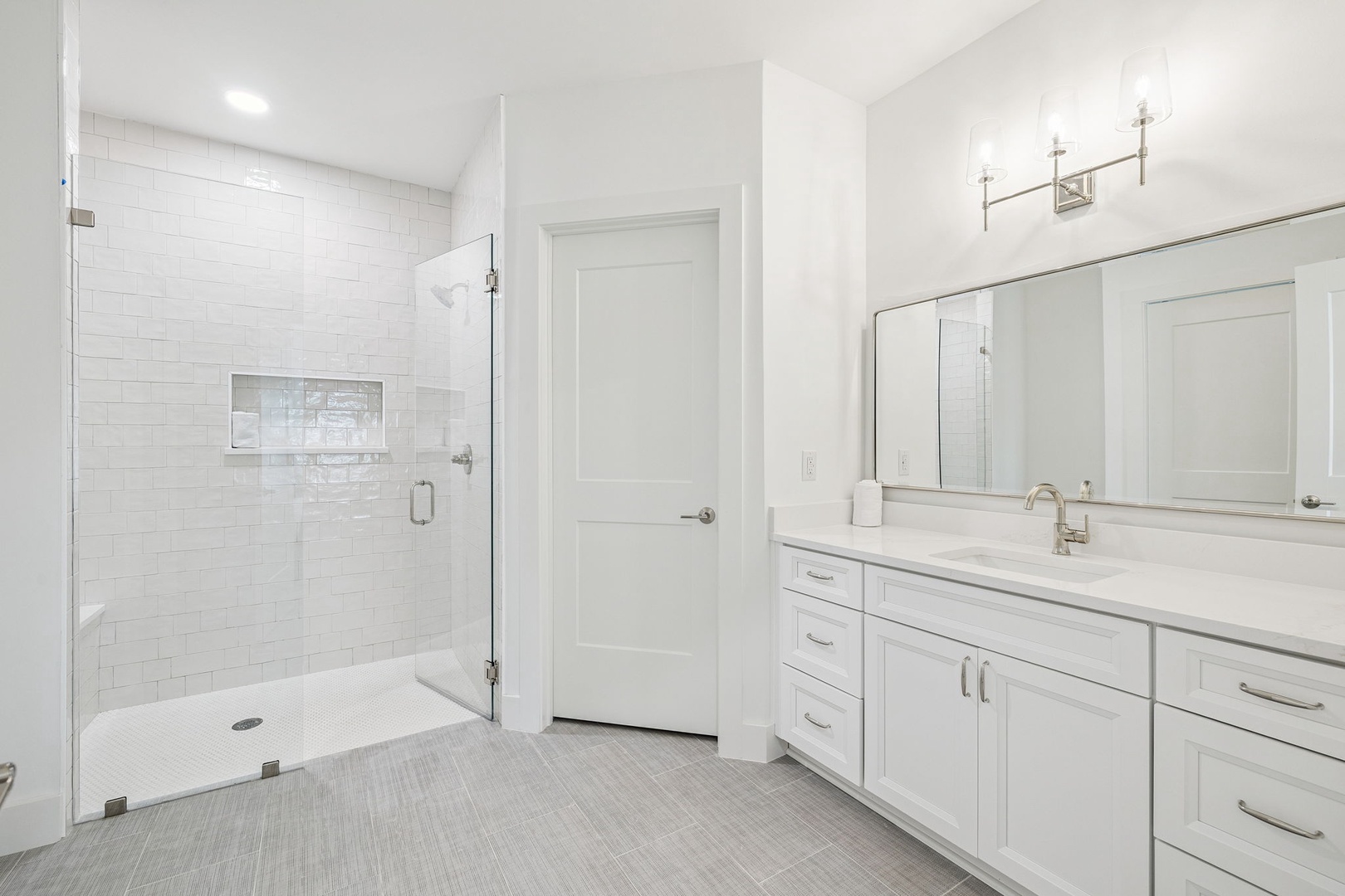 Step into your pristine spa-like bathroom with sleek subway tiles and elegant finishes that invite relaxation.