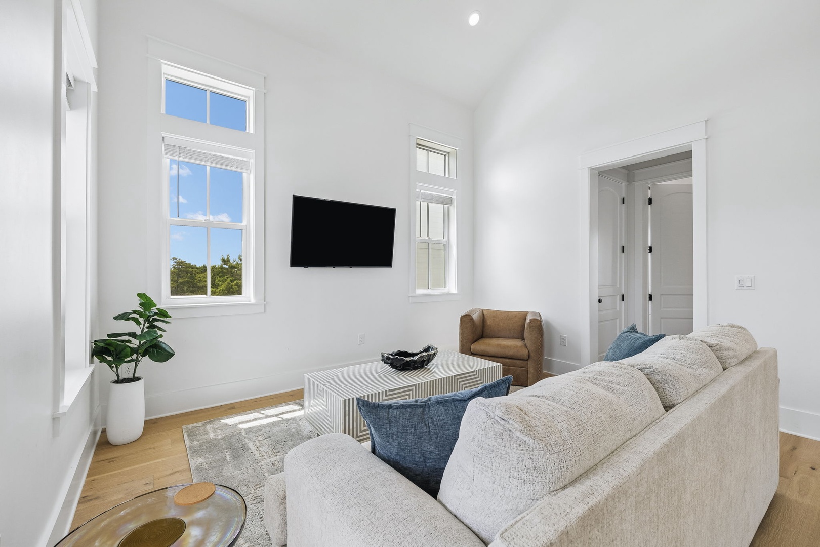 Unwind in your bright and airy living space, where tall ceilings and natural light create a perfect retreat for relaxing after a day of adventure.